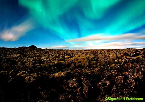 Aurora Over Clouds