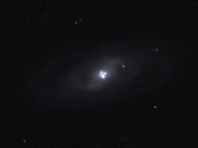 The Einstein Cross Gravitational Lens