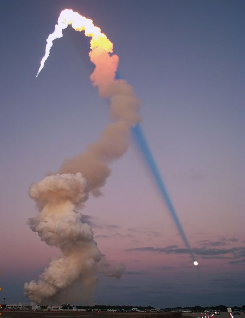 Shuttle Plume Shadow Points to Moon