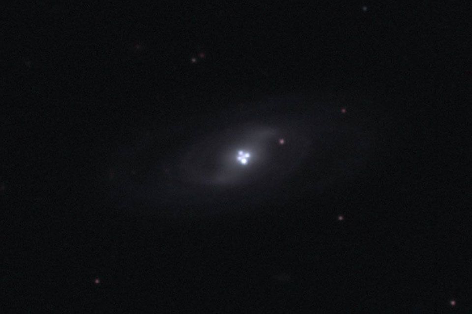 The Einstein Cross Gravitational Lens
