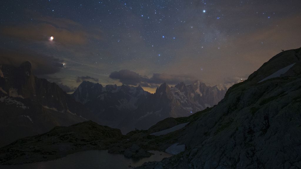 Eclipsed Moon and Mars over Mountains